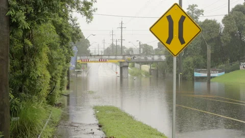 Road under a rail bridge in flood at windsor in australia Stock Footage 152966479