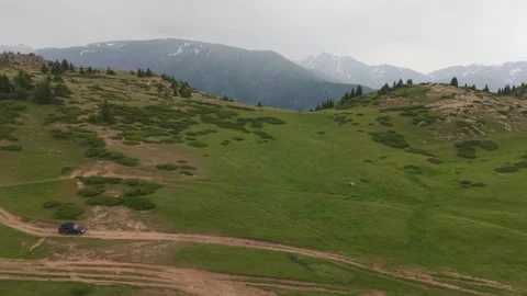 Off road vehicle traversing mountain path 스톡 동영상 312451643