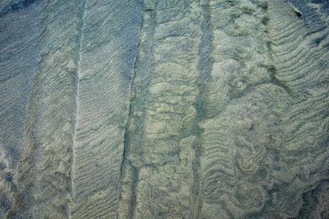 Off-road vehicle tyre track patterns in sand-dunes at Ripiro Beach near Pou.. Stock Photos