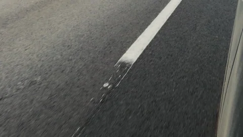 On the road, view of dashed roadway line from speeding car Vídeos de archivo 134531893