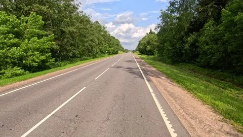 Road view on a summer day. Highways, roadside and white road line markings. Видео 336029310