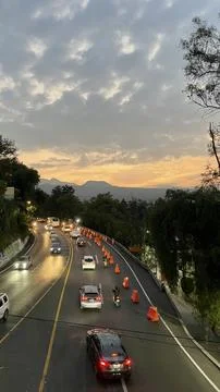 Road view at sunset time with a view of the mountain Stock Photos