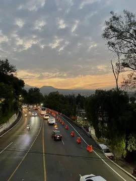Road view at sunset time with a view of the mountain Stock Photos
