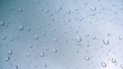 Road view through car window with rain drops Stock Photos