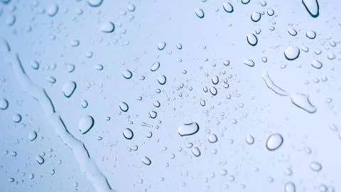 Road view through car window with rain drops Stock Photos