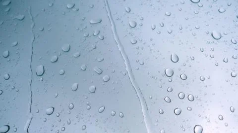 Road view through car window with rain drops Stock Photos