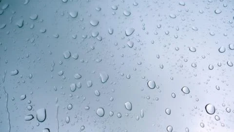 Road view through car window with rain drops Stock Photos