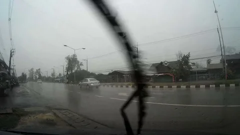 Road view through car windshield with rain drops, Waiting for cross the road Stock Footage 74270662