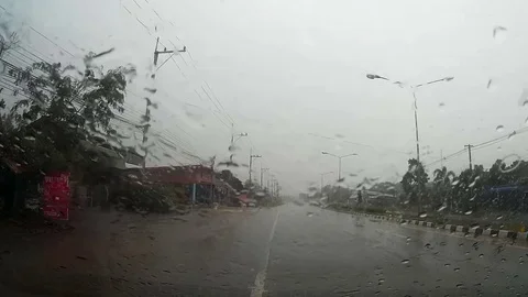 Road view through car windshield with rain drops, Driving in rain. Stock Footage 74838901