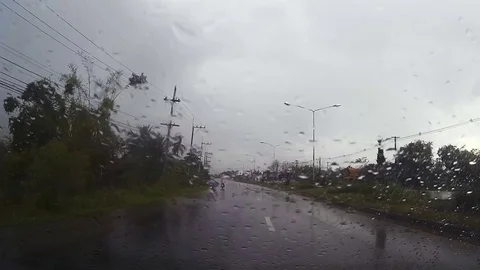 Road view through car windshield with rain drops, Driving in rain. Stock Footage 79331562