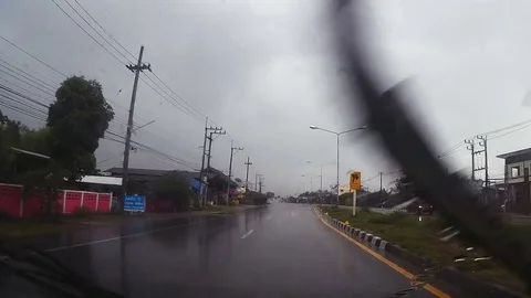 Road view through car windshield with rain drops, Driving in rain. Stock Footage 79587011