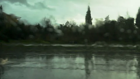 Road view through car windshield with rain drops Stock Footage 86205616