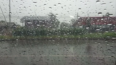 Road view through car windshield with rain drops, Waiting for cross the road. Stock Footage 98498983