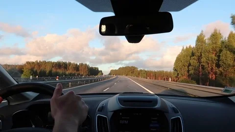 Road view through car windshield, dashboard and steering wheel 動画素材 109503227