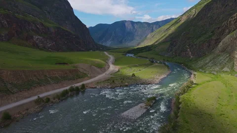 Road with views of the mountains and the river Stock Footage 245621276