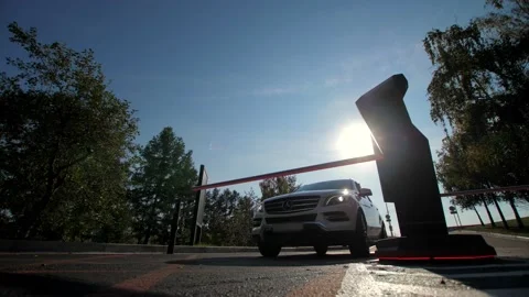 Off road white car pulls into a paid parking lot in summer Stock Footage 164922141
