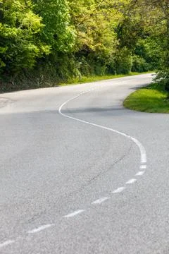 A road with a white line down the middle Stock Photos
