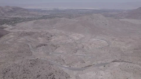 Road winding through desert mountain range Stock Footage 246334501
