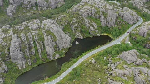 Road winding through lakes and rocky mountains in Southern Norway Stock Footage 111140698