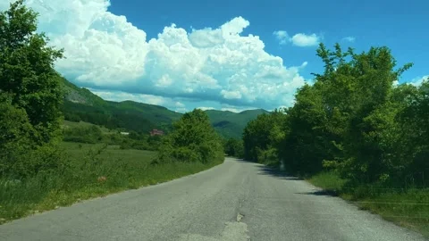 Road winds through lush green hills and trees. Balkans, Serbia Stock-Footage 337487333