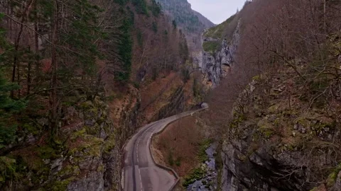 Road winds through rocky terrain near Villard de Lans Stock Footage 307316315