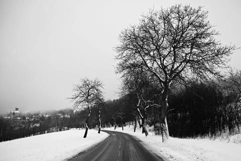 Road in winter. Snowy mountain path for a car. Concept for traveling and safe Stock Photos
