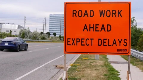 Road work and construction warning sign on city street Stock Footage 91320668