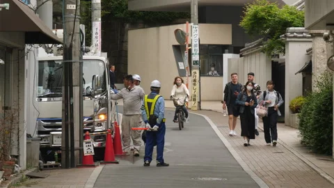 Road work and traffic controller in Tokyo, Japan. Stock Footage 248904039