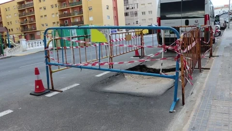 Road work, construction site, red white tape, slight pan Stock Footage 238000833