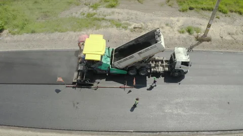 Road work. Large machine work on a new road construction site. Stock Footage 171947476