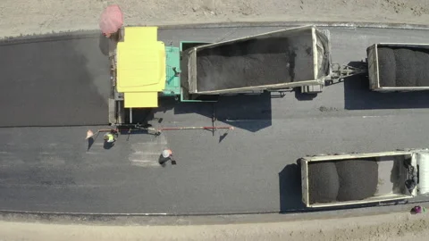 Road work. Large machine work on a new road construction site. Stockbeeldmateriaal 202226152