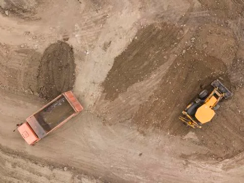 Road work. Large machine work on a new road construction site. Aerial view from Foto stock