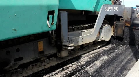 Road work. Machine for paving apply asphalt to street. Machine pouring asphalt. Stock Footage 41458875