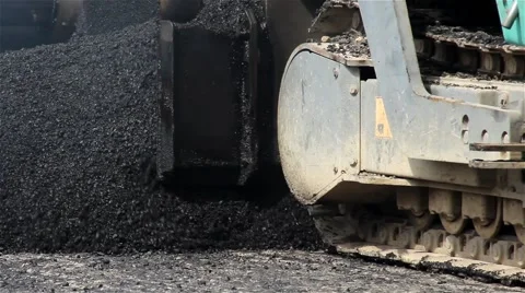 Road work. Paver machine pouring asphalt. Spillage of asphalt. Close up. 25 fps. Stock-Footage 41459458