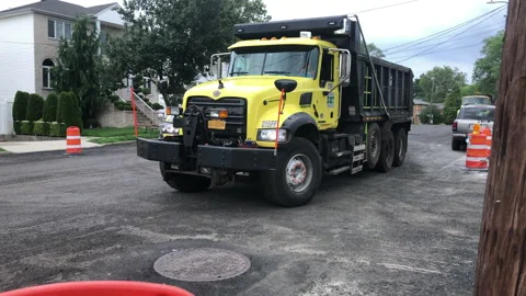 Road work, Street Closed, Dump Truck drives through work zone. Stock Footage 158060436