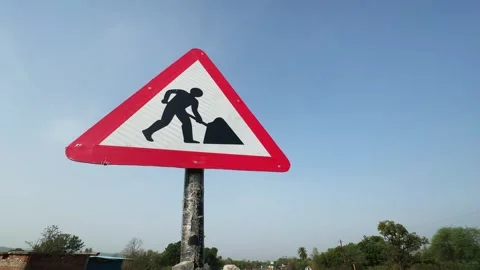 Road Work Warning Sign with Passing Truck Stock Footage 337437831