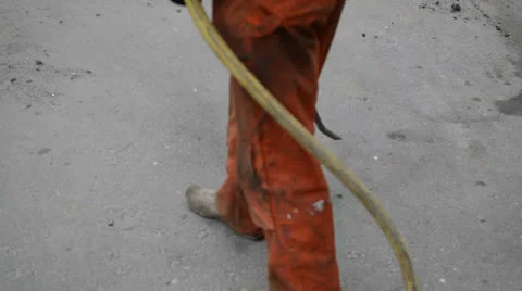 Road worker cleaning with compressed air Stock Footage 24821846