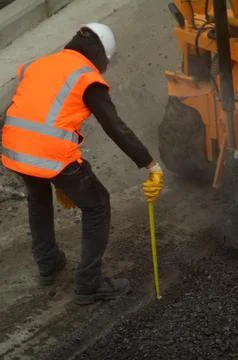 Road worker during asphalt work repair Fotos Stock