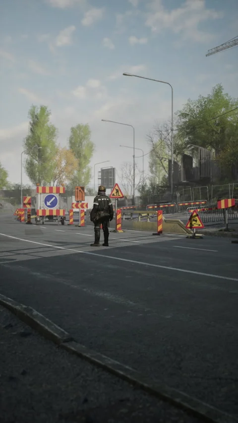 Road worker managing construction site at busy intersection during sunny day Video stock 347189305