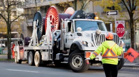 Road worker regulating traffic Stock Footage 57787125