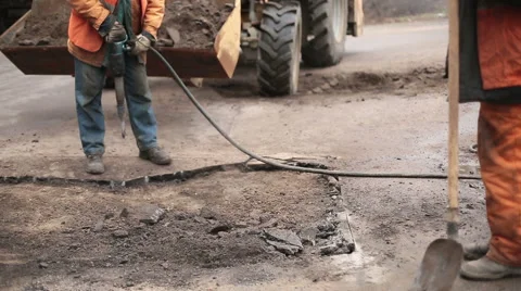 Road Worker Using Jackhammer Stock Footage 61566430
