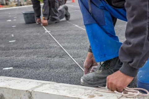 Road workers chalking Stock Photos