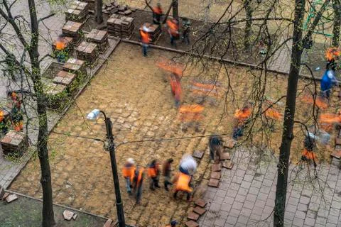 Road workers dismantled tile pavement Stock Photos