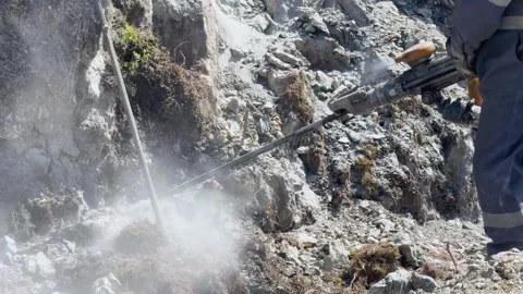 Road Workers Drilling Rock For Blasting Stock-Footage 333716064