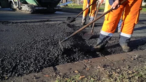 Road workers lay asphalt. Video stock 259056719