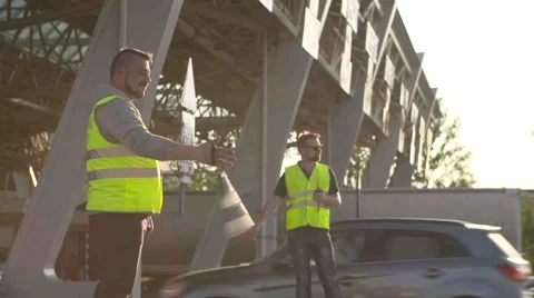 Road workers with Traffic rod isolated and walkie talkie work at checkpoint toll Stock Footage 64079854