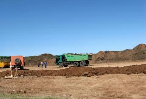 Road working on the new road construction site. Highway road works constructi Stock Photos