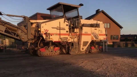 Road works. The machine removes asphalt road. Stock Footage 80766570