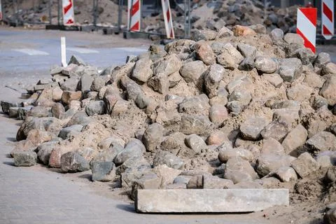 Road works. Stack with cobblestone, paving. Selective focus Stock Photos