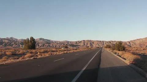 ROAD2LA-0011 TIMELAPSE DRIVING SUNSET IN THE DESERT Stock Footage 10712869